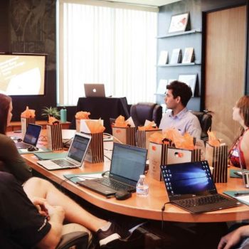 Employees having a meeting with the focus con company culture