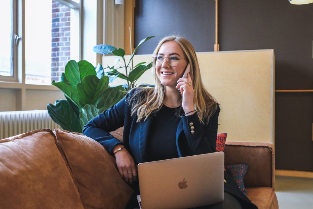 An employee working from their sofa at home in remote work