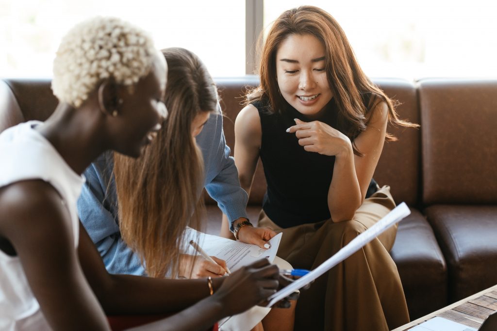 3 employees conducting a performance review.