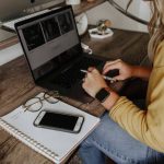 An employee having an asyncronous conversation working remotely from her home