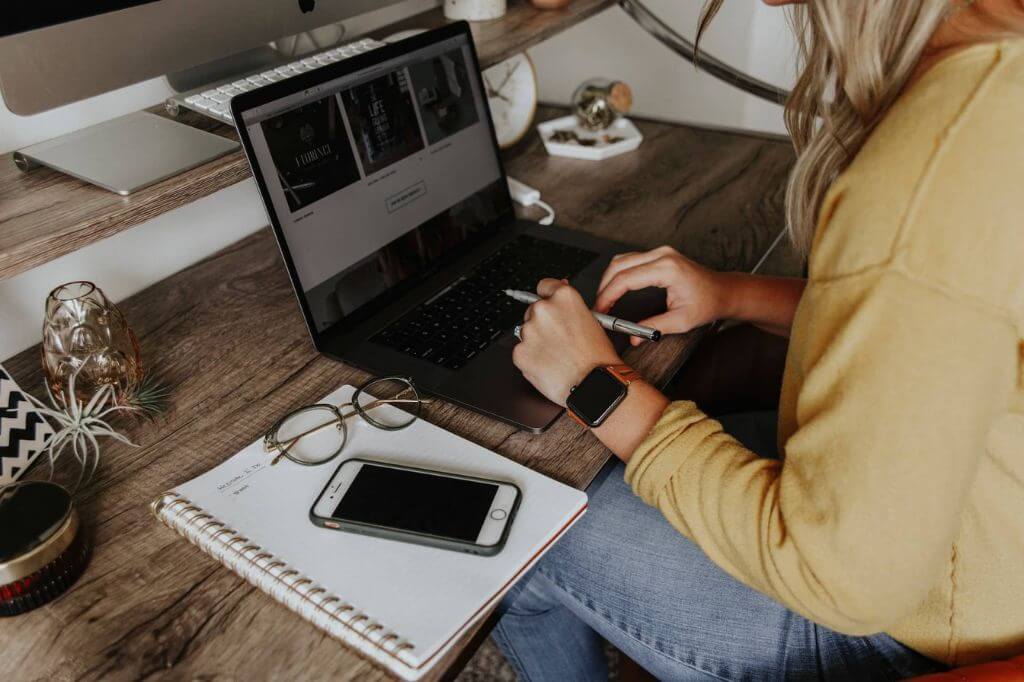 An employee having an asyncronous conversation working remotely from her home