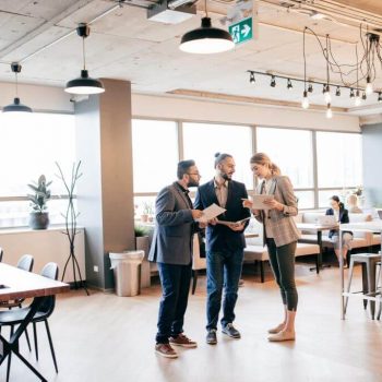 Employees gather at the offices talking